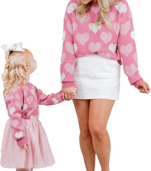 Mommy and me matching pink sweatshirts with heart images. A perfect gift for Valentine's Day.